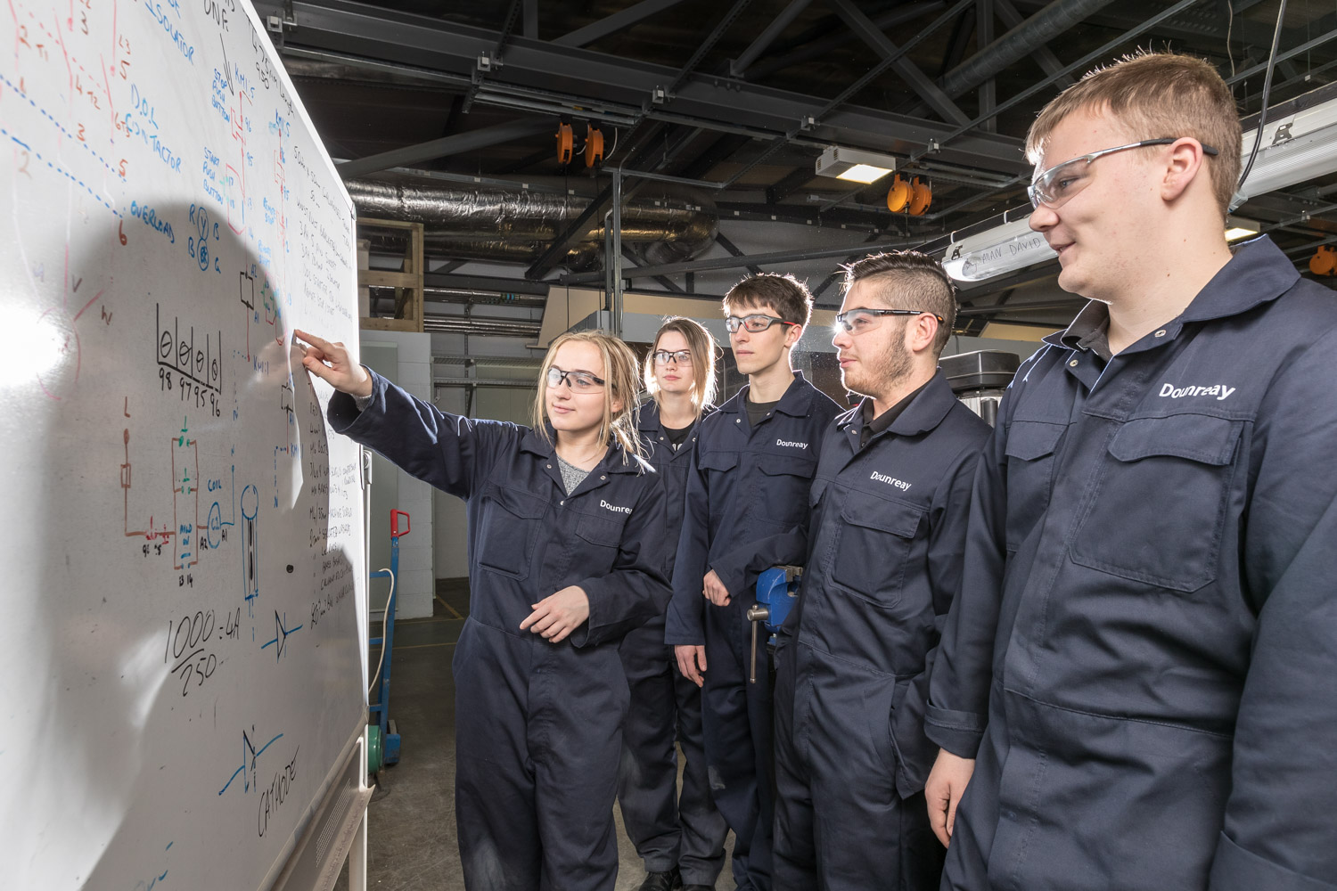 College students working on whiteboard